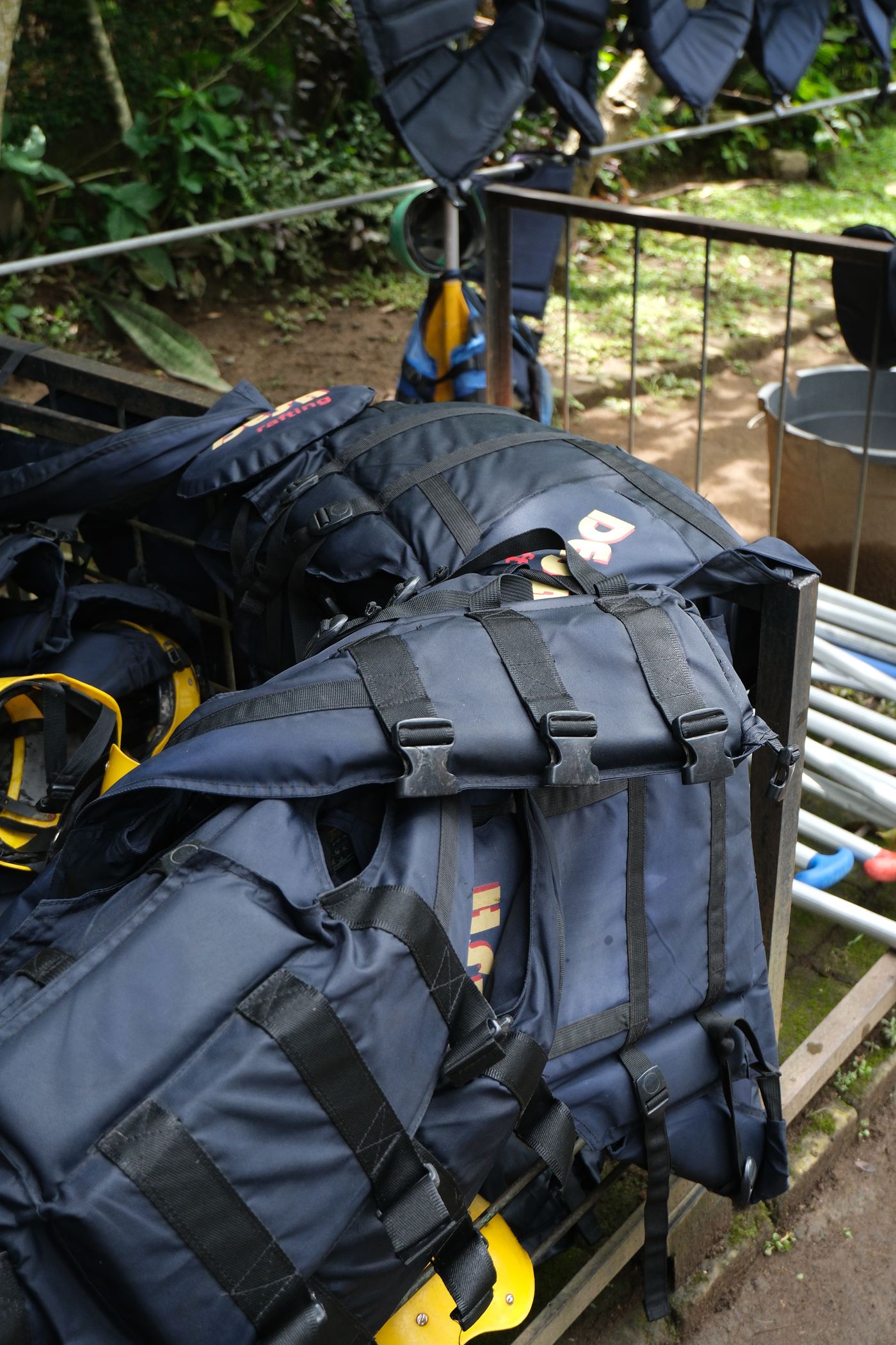 Bali Desa Rafting branded life jackets stacked and ready for guests